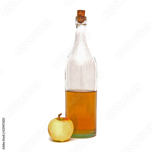 high bottle with apple cider vinegar and one apple isolated on white background. photo