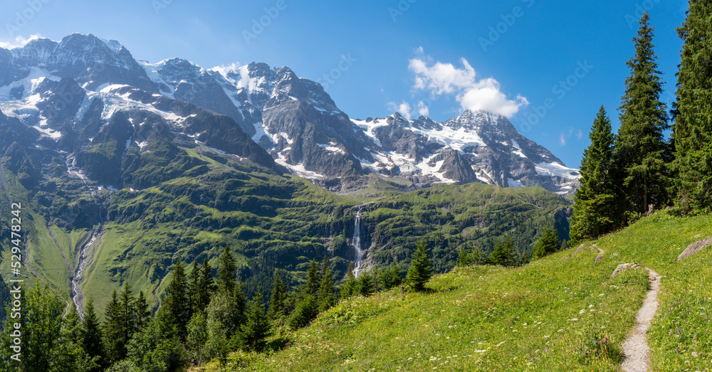 The Hineres Lauterbrunnental valley with the peaks Mittaghorn and Grosshorn and Breithorn and Holdrifall waterfall.