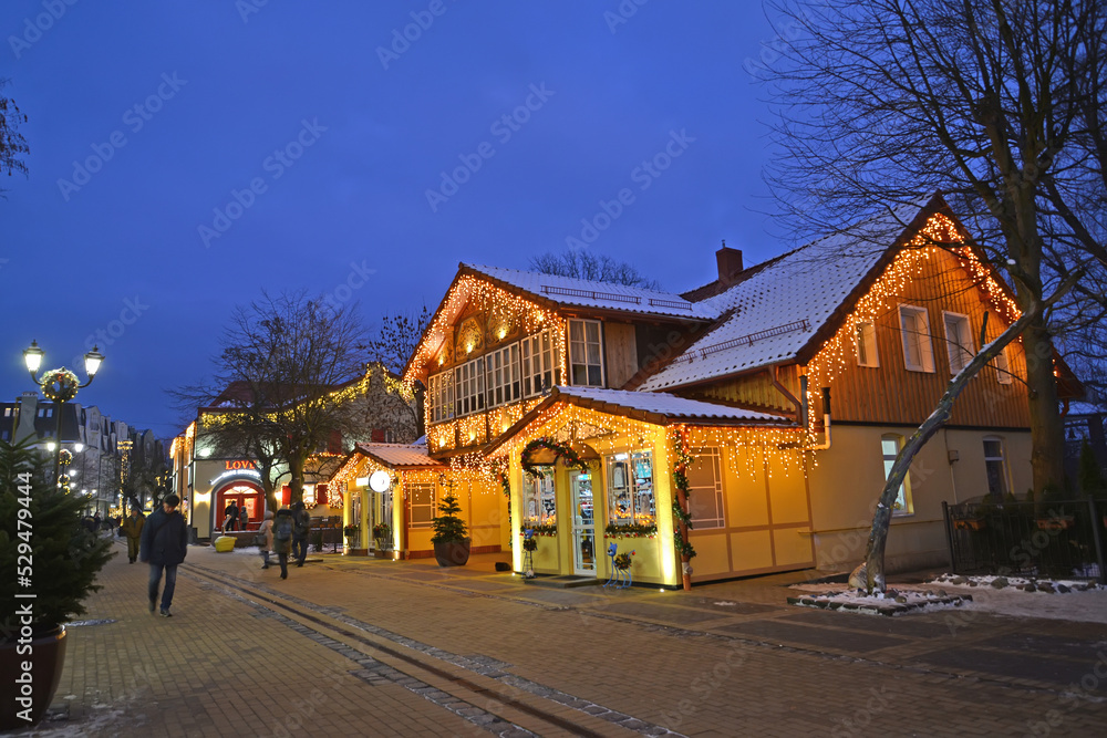 ZELENOGRADSK, RUSSIA - JANUARY 11, 2022: View of Kurortny Prospekt with New Year's decorations on buildings. Kaliningrad region