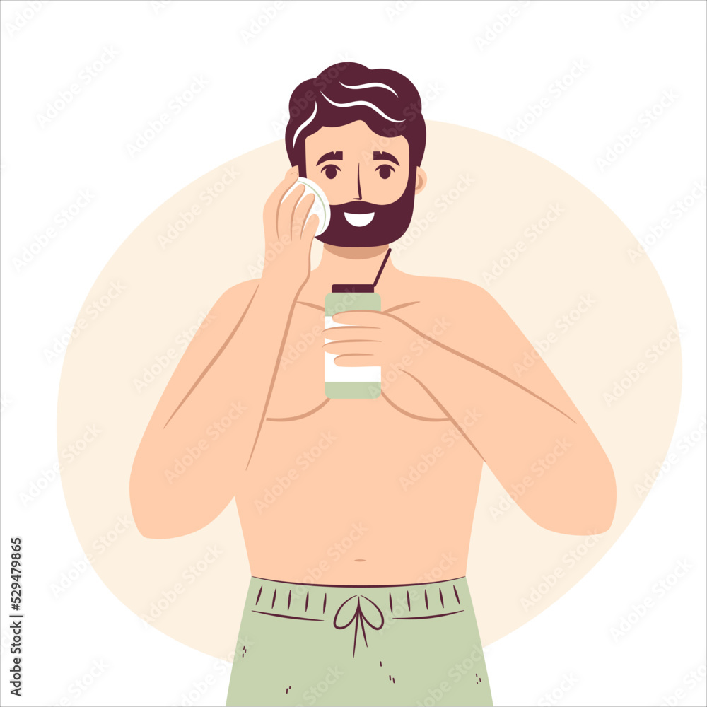 Skincare routine concept. Happy young man using cotton pad removing makeup, aftershave cosmetics or tonic, handsome bearded male enjoying skincare procedure. Men hygiene Skincare routine concept. Happy young man using cotton pad removing makeup, aftershave cosmetics or tonic, handsome bearded male enjoying skincare procedure. Men hygiene