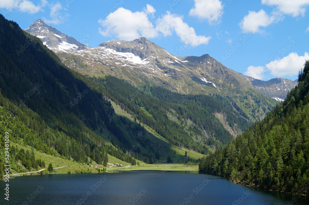 scenic lush green alpine landscape with a lake and fir trees and snowy Alps of the Schladming-Dachstein region in Austria (Steiermark or Styria)
scenic lush green alpine landscape with a lake and fir trees and snowy Alps of the Schladming-Dachstein region in Austria (Steiermark or Styria)