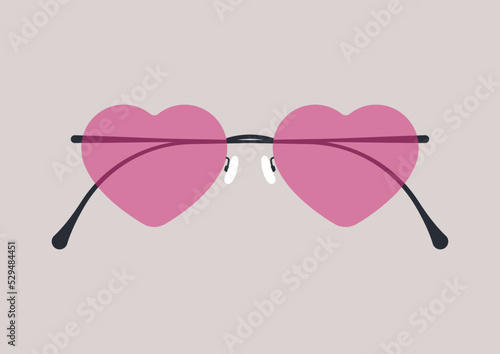 Seeing the world through rose-colored glasses concept, stylish heart-shaped eyewear