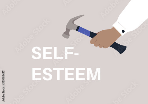 Hand destroying a self-esteem sign with a hammer, abusive manipulations and insecurities, mental health issues