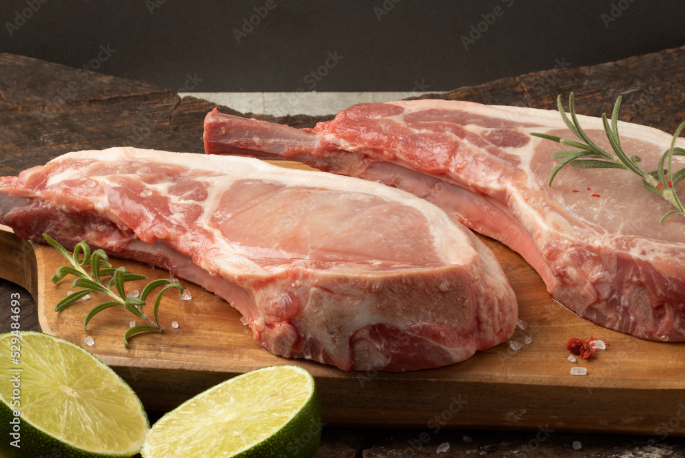 Raw prime rib steak on cutting board. Selective focus.