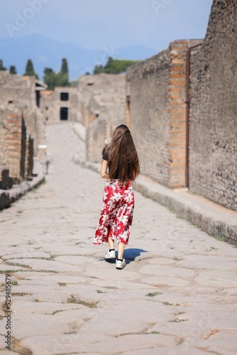 Travel photo of woman amongs some ancient ruins