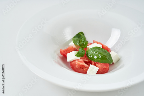 light salad with tomatoes and cheese
