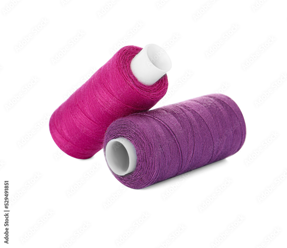 Different colorful sewing threads on white background Different colorful sewing threads on white background