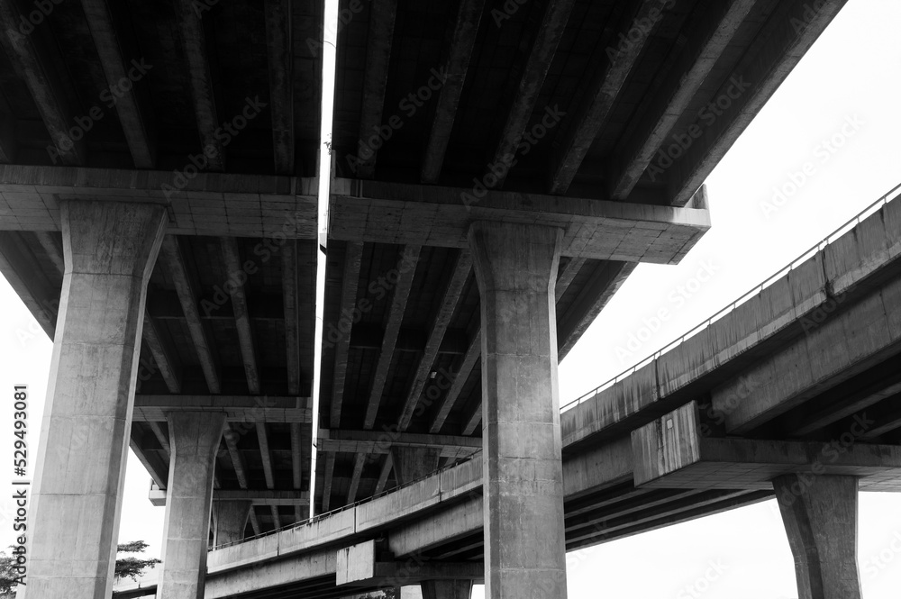 Black and white photo of architecture lines under the bridge Black and white photo of architecture lines under the bridge