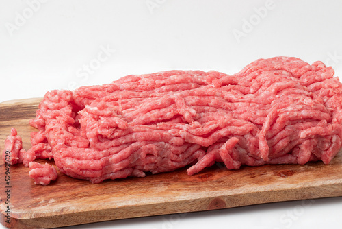 Minced beef on cutting board.