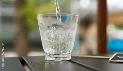 glass of water with ice on the table