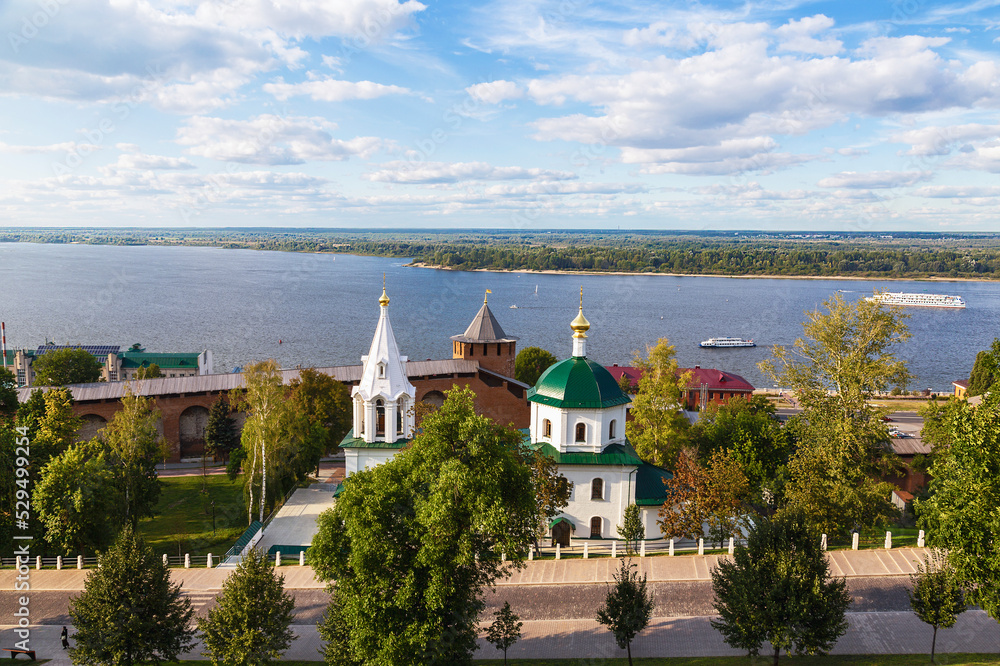 View of the Volga River, the Temple of St. Simeon the Stylite in the Kremlin and ships sailing along the Volga. Nizhny Novgorod, Russia
