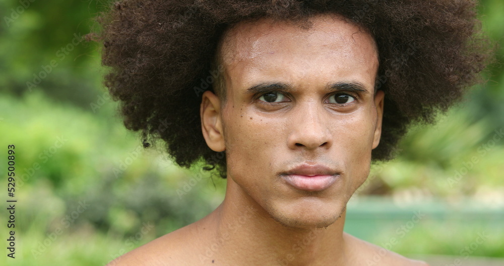 African mixed black becomes serious tighting jaw, feeling angry African mixed black becomes serious tighting jaw, feeling angry