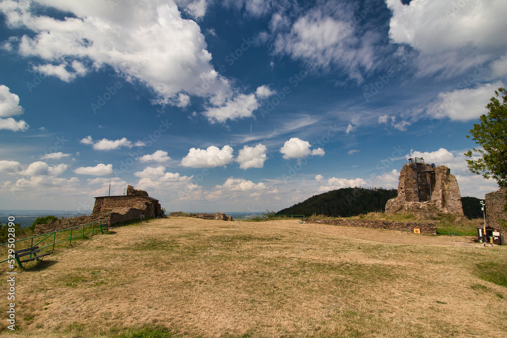 Ruins of Lichnice castle in summer cloudy day. Czech Republic.