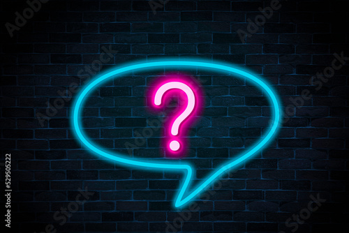 Question sign symbol neon banner on brick wall background with copy space.