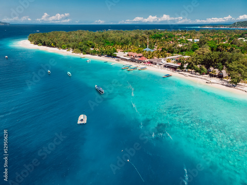 Tropical beach, blue ocean and boats. Aerial view.