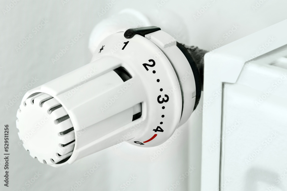 White heater and thermostat close up White heater and thermostat close up