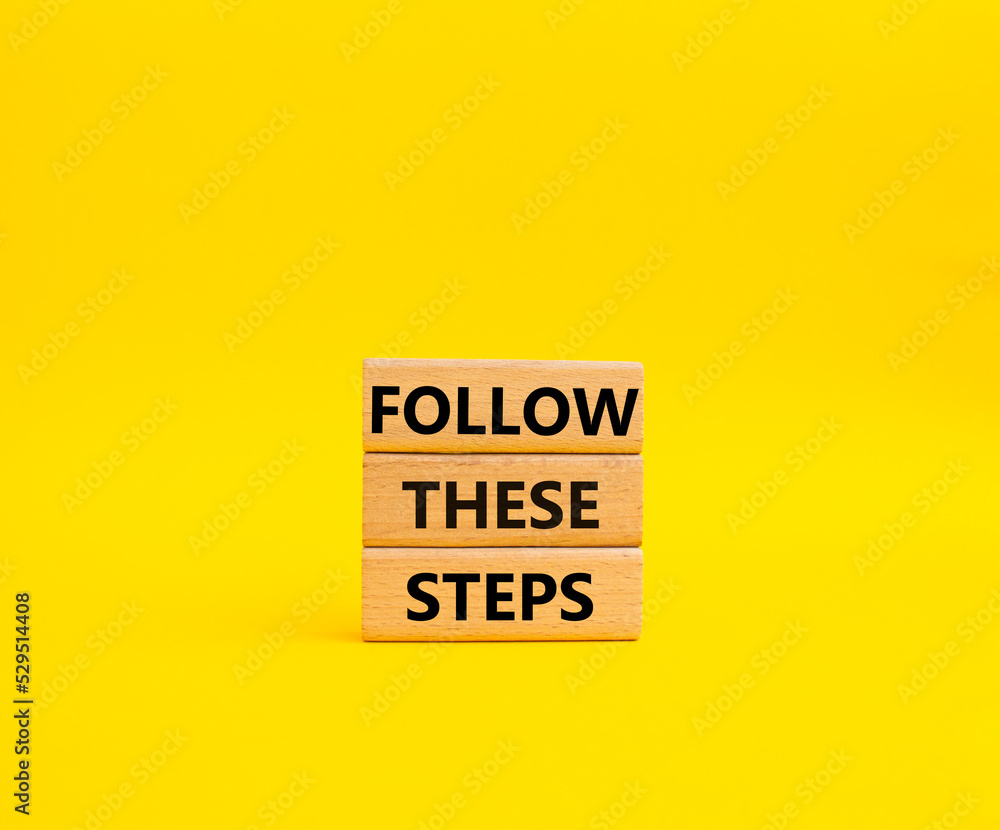 Follow these steps symbol. Wooden blocks with words Follow these steps. Beautiful yellow background. Business and Follow these steps concept. Copy space. Follow these steps symbol. Wooden blocks with words Follow these steps. Beautiful yellow background. Business and Follow these steps concept. Copy space.