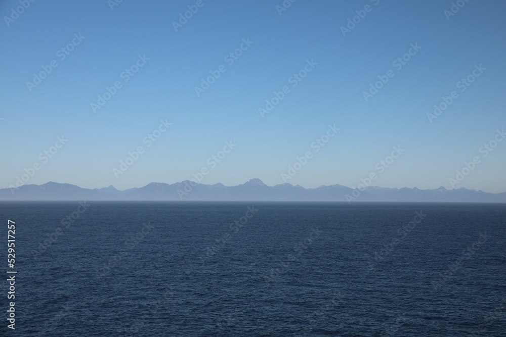 Distant mountain range seen from the approaching ship