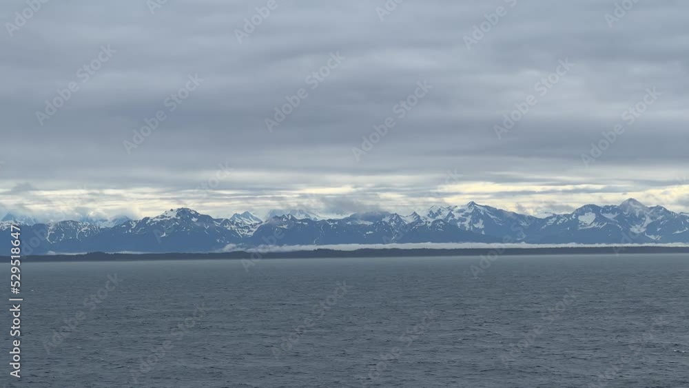 Coastal mountains and views from a cruise ship close to the Hubbard Glacier in Alaska. The Hubbard Glacier is a popular stop for Alaskan cruises. Coastal mountains and views from a cruise ship close to the Hubbard Glacier in Alaska. The Hubbard Glacier is a popular stop for Alaskan cruises.