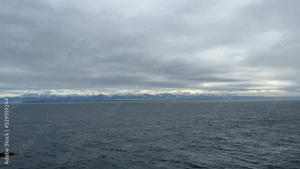 Coastal mountains and views from a cruise ship close to the Hubbard Glacier in Alaska. The Hubbard Glacier is a popular stop for Alaskan cruises. Coastal mountains and views from a cruise ship close to the Hubbard Glacier in Alaska. The Hubbard Glacier is a popular stop for Alaskan cruises.
