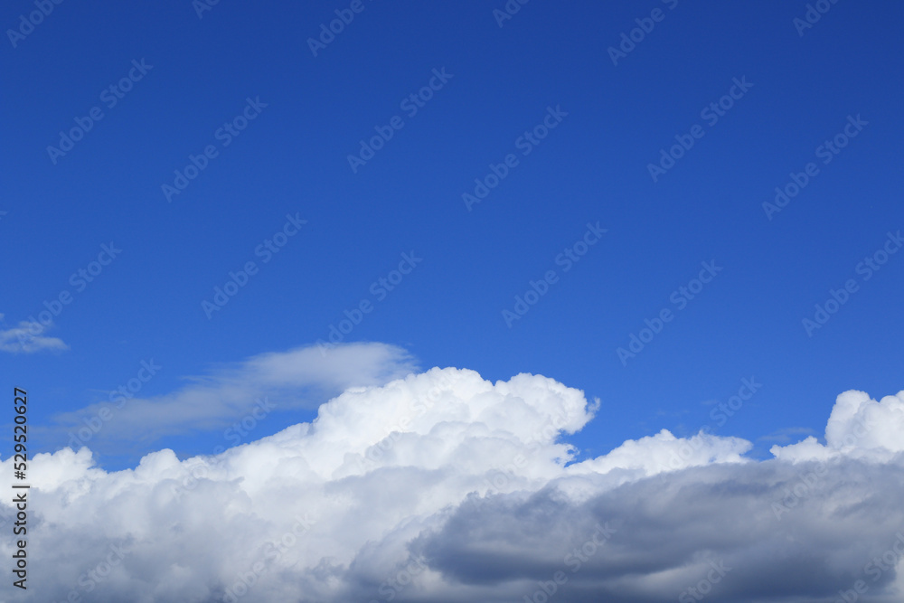 white fluffy cumulus clouds and blue sky with free space white fluffy cumulus clouds and blue sky with free space