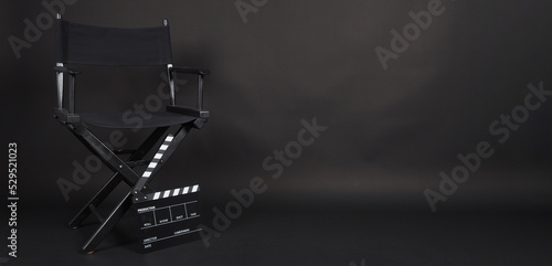 Billede på lærred Black Director chair and black clapper board or movie slate on black blackground