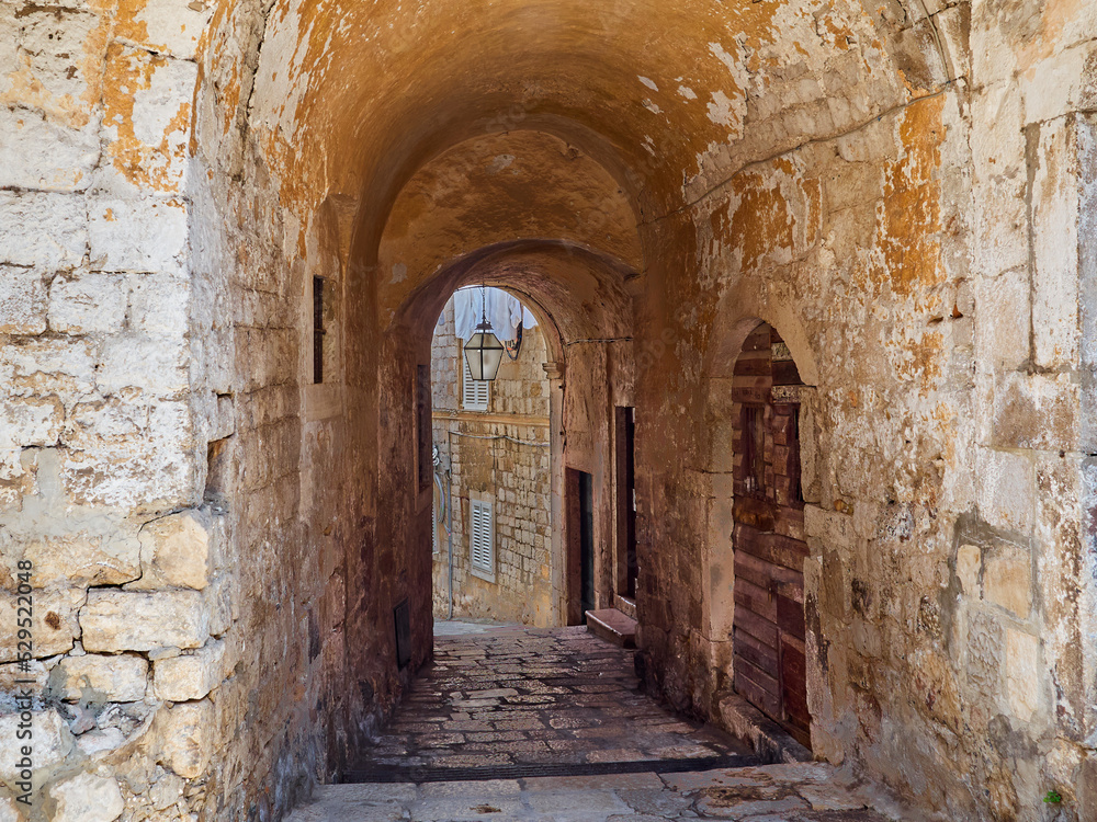 Ancient stone archway in Dubrovnik Old Town. Croatia, Europe