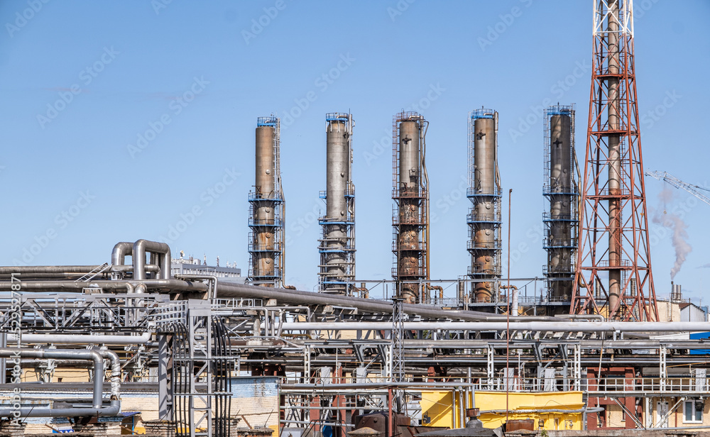 Process zone structure, pipelines, engineering equipment in an oil refinery, photo for technology and oil and gas industrial concept