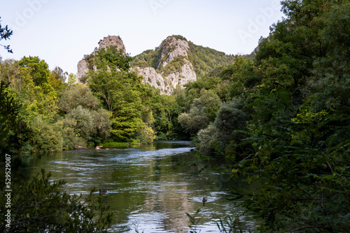 Beautiful rocky cliffs and mountain peaks, covered with dense forest near the town of Omis, Croatia in the Cetina river canyon
