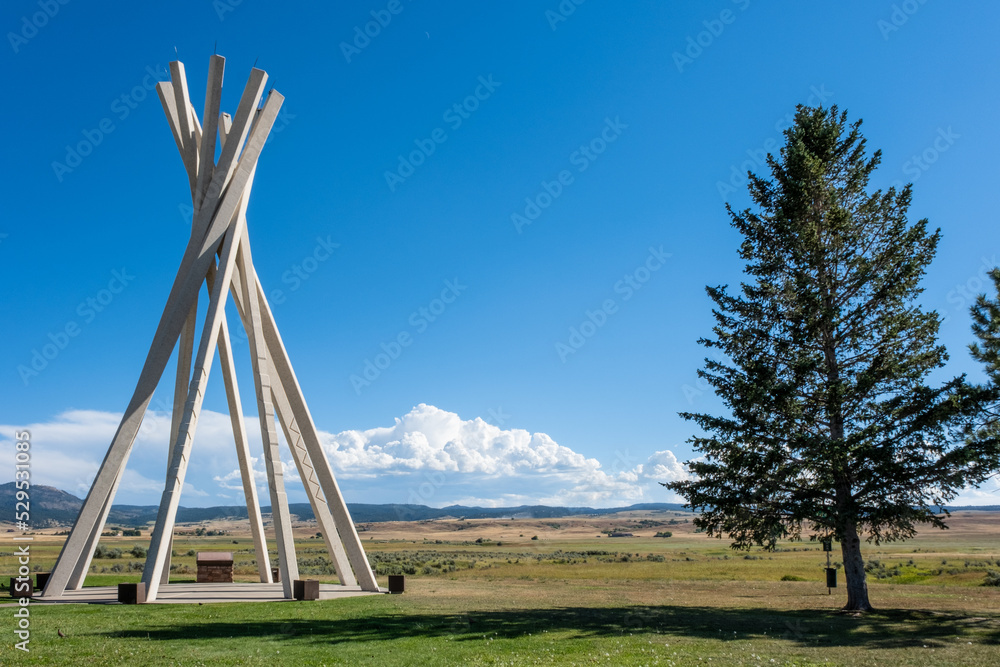 Cement teepee and a tree at a South Dakota rest stop on a sunny, summer day. Cement teepee and a tree at a South Dakota rest stop on a sunny, summer day.