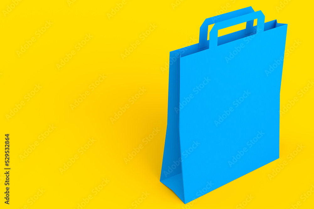 Folded kraft paper bag with handle isolated on yellow background. Folded kraft paper bag with handle isolated on yellow background.