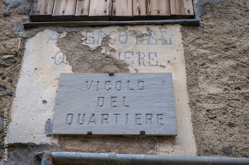 Street name plate in a village in the Occitan region (Ligurian Alps, Realdo, Imperia).  Is a region between France and Italy, where the ancient medieval French is spoken, called "Langue d'Oc".