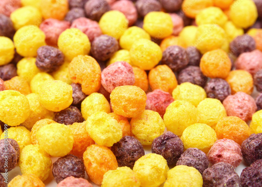Delicious and nutritious fruit cereal loops flavorful, healthy and funny addition to kids breakfast on white background Delicious and nutritious fruit cereal loops flavorful, healthy and funny addition to kids breakfast on white background