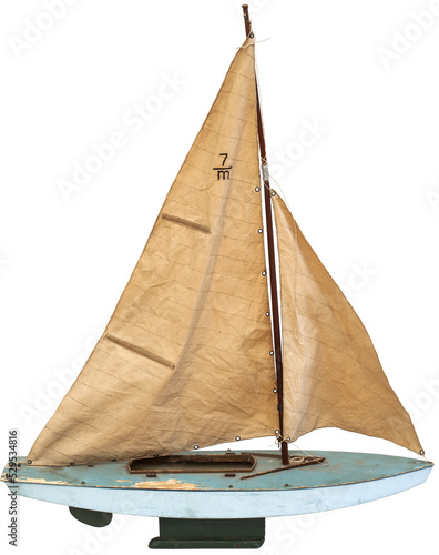 Wooden toy sailing boat on transparent background  photo