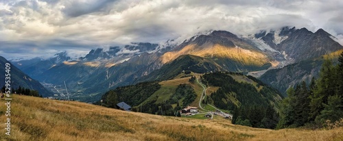 Cloudy mountain panorama at the T  te de la Charme near Saint-Gervais-les-Bains. View of the Mont Blanc massif.