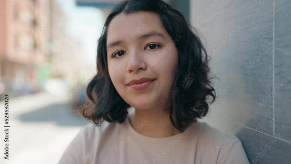Young woman smiling confident standing at street Young woman smiling confident standing at street