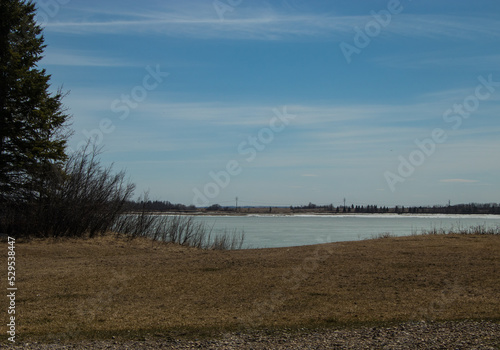 Ice still clings to the top of the lake. Glkeniffer Lake PRA  Red Deer County  Alberta  Canada