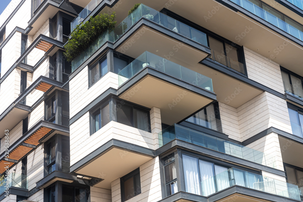 Obraz premium View on balconies of modern apartments exterior at daylight