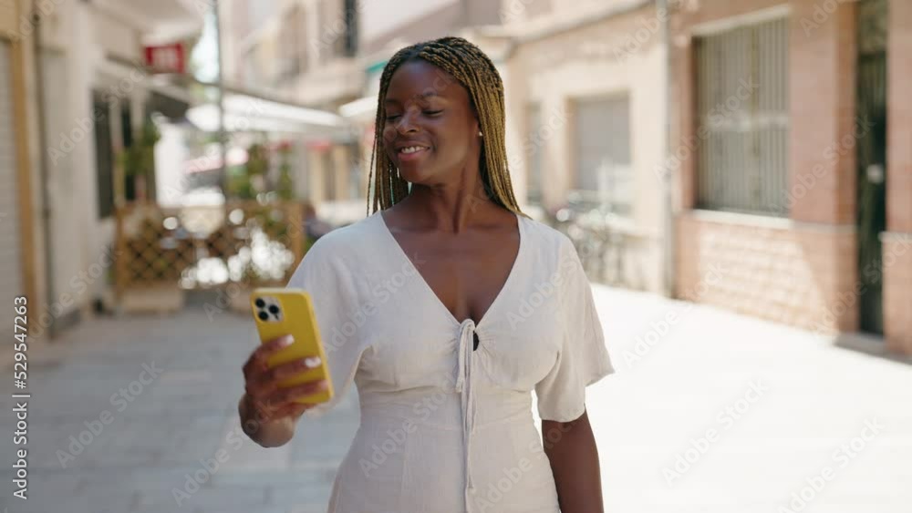 African american woman smiling confident making selfie by the smartphone at street African american woman smiling confident making selfie by the smartphone at street