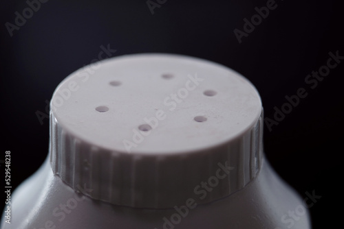 Close up of talcum bottle photo