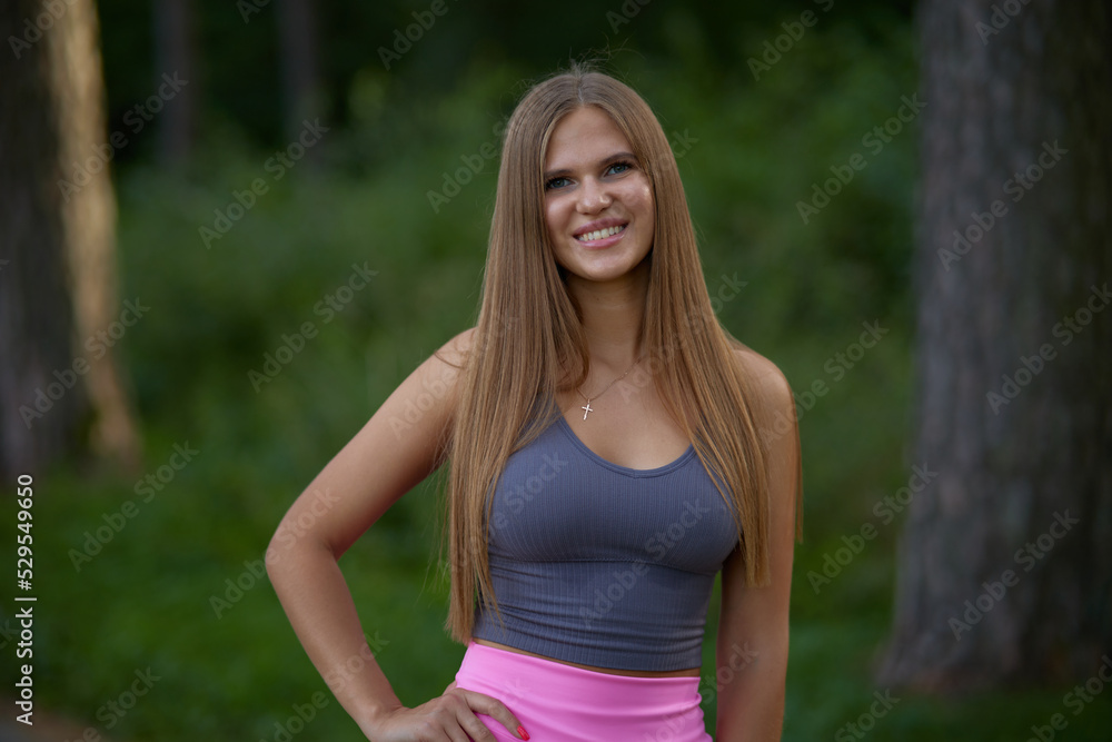 Lovely young woman with sexy boobs in trendy gray top in pink fashionable sports shorts walking on street. Pretty beauty girl fashion model walks in park. Healthy lifestyle.
Lovely young woman with sexy boobs in trendy gray top in pink fashionable sports shorts walking on street. Pretty beauty girl fashion model walks in park. Healthy lifestyle.