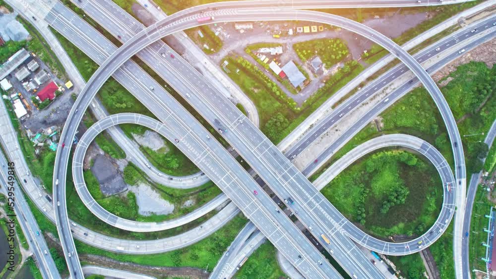 4K : Aerial view shot of fast moving above interchange and motorway road. Lots of cars are driving. traffic time lapse. infrastructure in thailand. hyperlapse. traffic in Bangkok, Thailand
4K : Aerial view shot of fast moving above interchange and motorway road. Lots of cars are driving. traffic time lapse. infrastructure in thailand. hyperlapse. traffic in Bangkok, Thailand