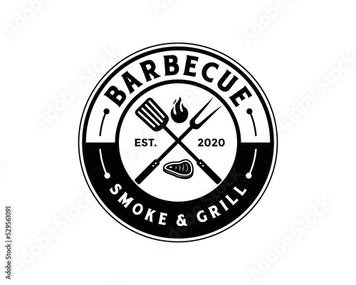 Grill fork and spatula tools with fire and fresh meat for barbecue or BBQ symbol icon vector. Smoke and grill logo design