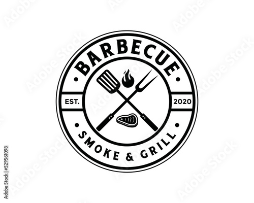 Grill fork and spatula tools with fire and fresh meat for barbecue or BBQ symbol icon vector. Smoke and grill logo design