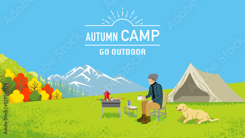 Young man and his dog enjoying camp in autumn nature - Included words