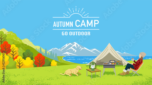Young woman enjoying camp in autumn nature with her dog - Included words