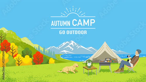 Young man enjoying camp in autumn nature with his dog - Included words