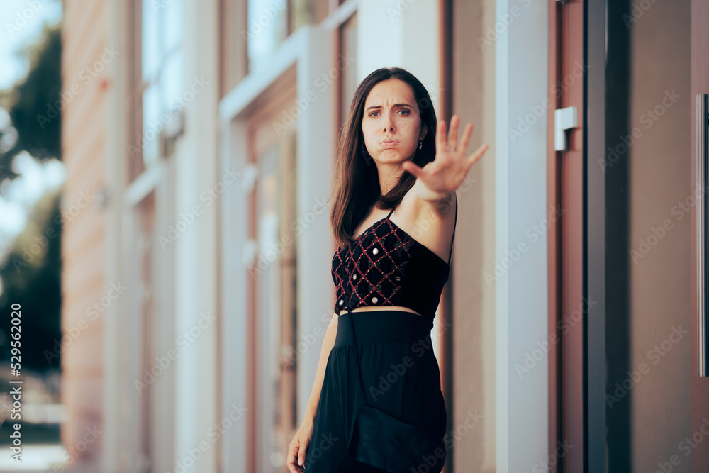 Unhappy Woman Making Stop Sign Feeling Bothered. Unhappy girl tired of catcalling and other suggestive comments on the street

