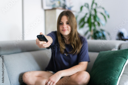 girl using remote control photo