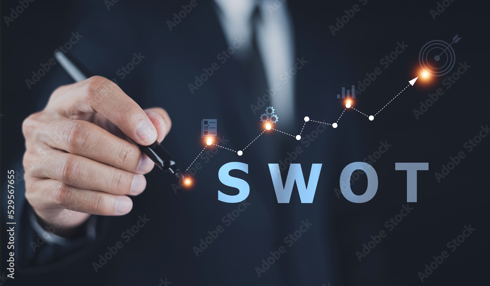 SWOT analysis concept, businessman drawing swot analysis strategy for business plan and growth
